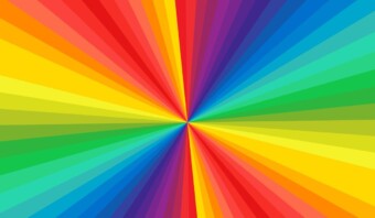 Fondo degradado radial colorido con rayos brillantes y simÃ©tricos que se extienden desde un punto central, cada rayo representa el significado de los colores en un espectro completo de colores del arco iris.