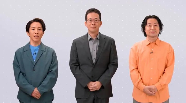 Tres personas se encuentran una al lado de la otra sobre un fondo de puntos gris claro, cada una con atuendos de diferentes colores: verde azulado, gris y naranja. Sus vibrantes estilos casi reflejan los esperados colores de lanzamiento que se rumorean para la Nintendo Switch 2.